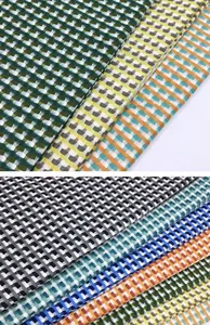 Close-up of fish scale pattern cotton linen jacquard fabric swatches in various colors