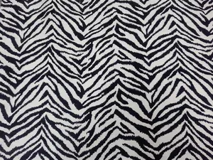 Tessuto jacquard ciniglia con stampa zebrata in bianco e nero per divani e cuscini.
