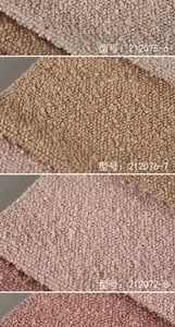 Detailed view of textured boucle fabric swatch showing soft lamb velvet surface and rich colors.