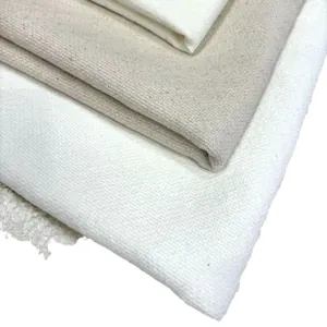 Natural linen and cotton fabric swatches in neutral tones showing coarse texture detail
