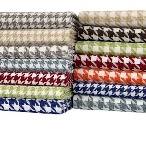 Stacked houndstooth woven linen cotton fabric in various colors for upholstery and clothing.