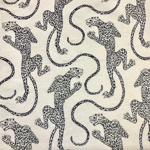 Close-up of retro white leopard jacquard Chenille fabric with intricate woven details
