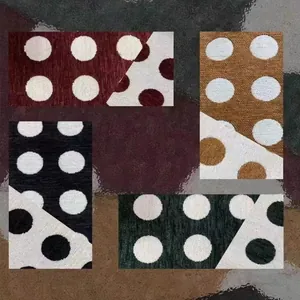 Detailed view of high-quality reversible polka dot chenille fabric for upholstery.