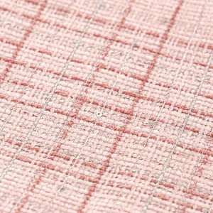 Macro view of pink tweed plaid fabric featuring elegant woven texture and silver sequins