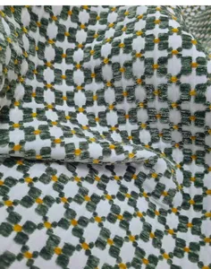 Detailed view of vintage green jacquard fabric with geometric patterns for DIY upholstery