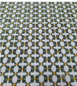 Detailed macro shot of retro green geometric jacquard fabric for upholstery and DIY