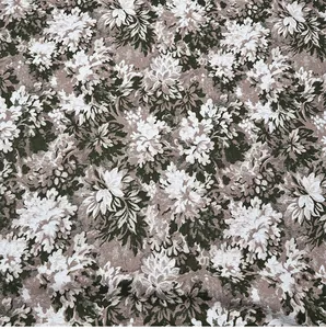 Gros plan de tissu jacquard floral vintage avec texture détaillée et tons terreux