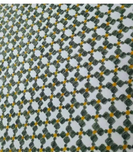 Detail shot of green and orange geometric jacquard fabric for upholstery
