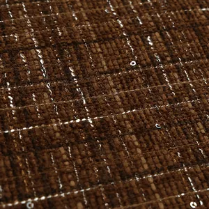 Macro detail of high-quality brown grid tweed fabric with sequins and metallic silver threads