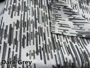 Vista dettagliata del tessuto jacquard ciniglia grigio scuro con motivo