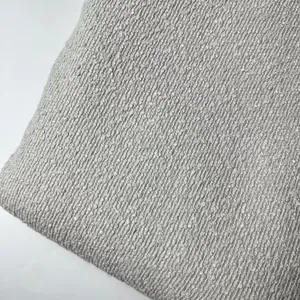 Close-up macro view of thick gray bouclé fabric showing detailed teddy linen texture