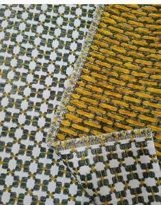 Close-up detailed view of vintage green jacquard fabric with textured geometric patterns
