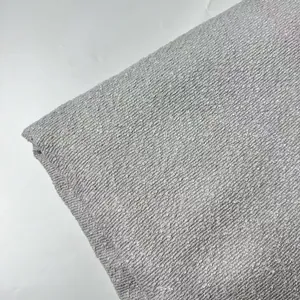 Detailed macro view of thick grey boucle fabric texture for sofa and cushion covers
