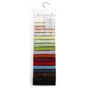 Professional hanging catalog of colorful tweed bouclé fabric swatches for clothing design