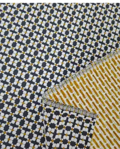 Detailed close-up of vintage geometric jacquard fabric showing front and back texture