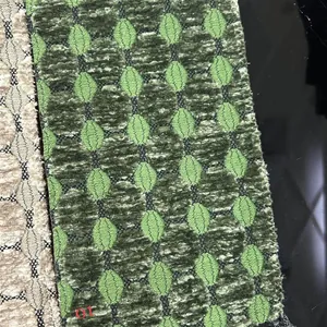 Macro view of thickened jacquard chenille fabric with green geometric oval patterns