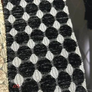Macro shot of black geometric circular pattern on thick jacquard chenille fabric