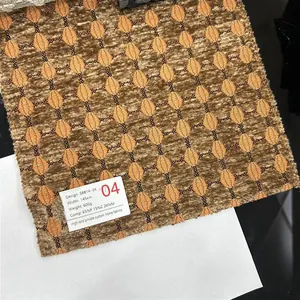 Close-up detail of thick jacquard chenille fabric with golden geometric diamond pattern