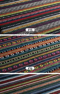 Detailed close-up of diverse ethnic style woven fabrics with colorful stripe patterns