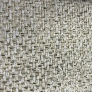 Vista macro de la textura de tela tejida engrosada de tono neutro para tapicería