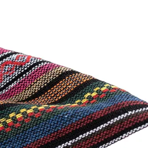 Detailed view of colorful ethnic style woven fabric with traditional geometric patterns