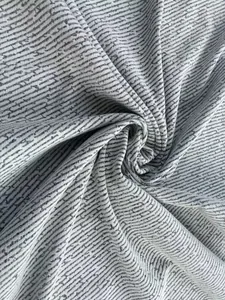 Close-up of chenille coarse spinning fabric with grey and white ripple twill pattern