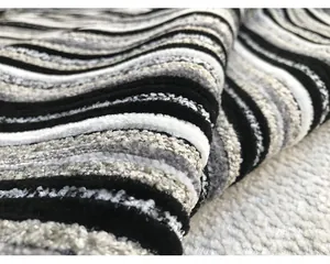 Macro view of textured black and white striped chenille fabric for upholstery