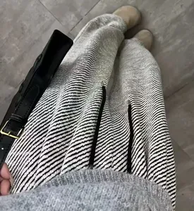 Macro view of grey and white chenille thick spun twill fabric on loose-fitting pants