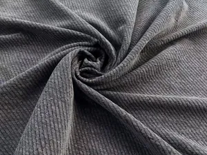 Macro view of dark gray chenille fabric with a coarse diagonal weave texture