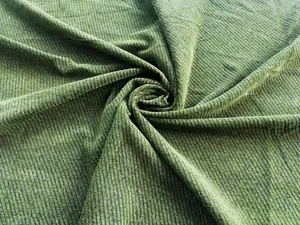 High-quality detailed macro shot of textured green chenille twill fabric for sofas