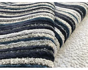 Macro view showing the soft texture of blue and grey striped 3D chenille fabric