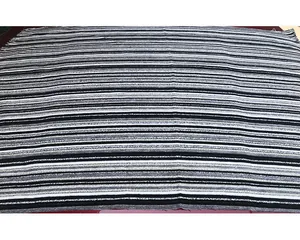 Detailed macro view of black and white striped chenille fabric texture for upholstery