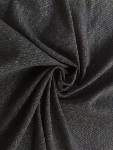 Close-up of dark grey chenille tweed fabric with heavy twill texture for upholstery