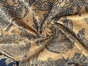 Detail of vintage tiger and mountain pattern chenille jacquard fabric for cushions