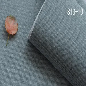 Gros plan du tissu Chenille bleu-gris montrant la texture détaillée du tissage.