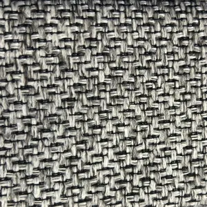 Vista macro de la textura de tela tejida gruesa y basta en gris y negro para sofás