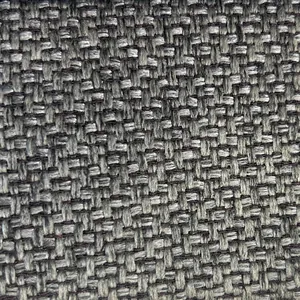 Detalle macro que muestra la textura de tela de lino grueso en gris carbón para sofás.