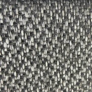 Vista macro de la textura de tela de lino grueso para sofás en tonos grises y beige.