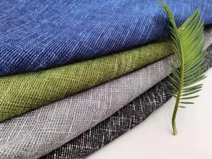 Dettaglio macro della trama del tessuto in lino ciniglia spesso nei toni blu verde e grigio