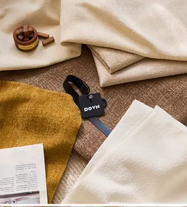 Detail view of premium gold thread chenille fabric in various warm earthy tones for decor
