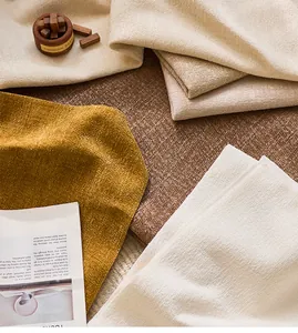 Detail view of luxury gold thread chenille sofa fabric in earthy color swatches.