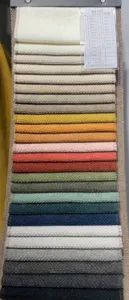 Detailed view of high-quality chenille fabric swatches in various colors for sofa and curtains