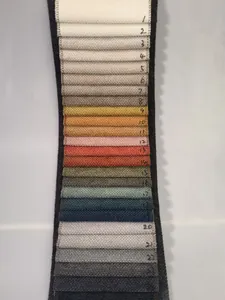 Close-up macro view of numbered chenille fabric swatches in various colors for upholstery