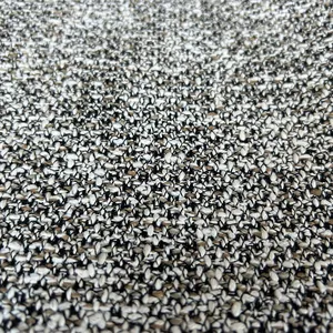 Macro view of textured tweed fabric weave in neutral colors for cushions and sofas
