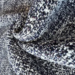Detailed macro view of high-quality multi-color woven tweed fabric texture with soft folds