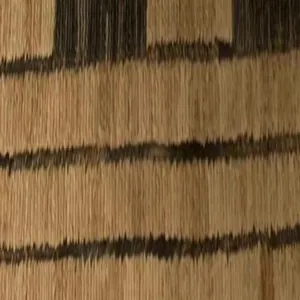 Macro detail shot showing the thick wool texture and brown striped pattern of a warm scarf