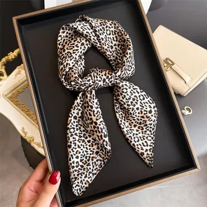 Elegant leopard print silk scarf belt tied in a bow, stylish French retro fashion accessory