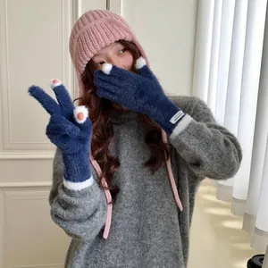Korean style soft coral fleece gloves with touchscreen finger hole and logo patch.