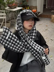 Chic black and white checkered knit scarf for women styled with a winter outfit