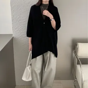 Elegant retro black knit shawl cardigan cover-up for women's early autumn fashion.